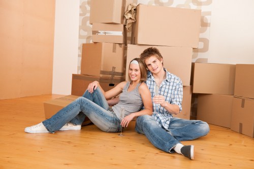 Family organizing belongings with Walthamstow storage for extra space