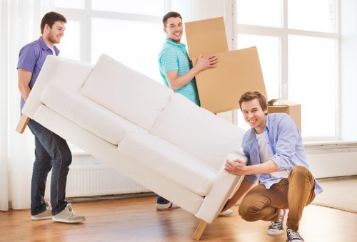 Removal team handling flat removals in Walthamstow outside an apartment building